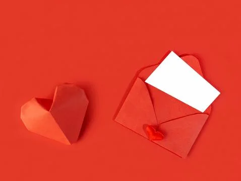 Red paper envelope with a note for Valentine's Day on a white background wi.. Stock Photos