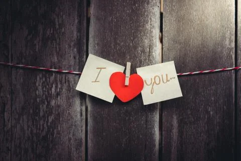 Red paper heart-shaped and words of love Stock Photos