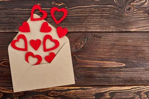 Red paper hearts and evelope, top view. Stock Photos