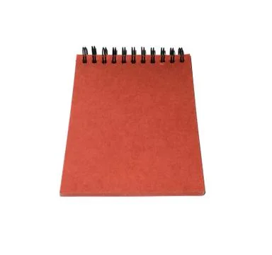 The red paper notebook is isolated on a white background. Foto stock