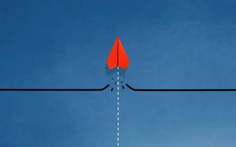 Red paper plane breaking through obstacle on blue background, Concept of ov.. Stock Photos