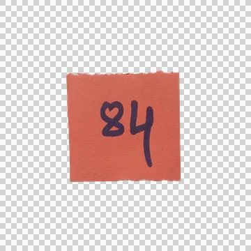 Red paper square note with the number eighty four written in dark ink Фото
