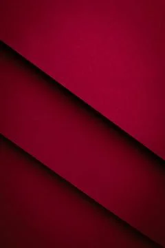 Red paper texture with overlapping layers creating geometric patterns in a .. Stock Photos