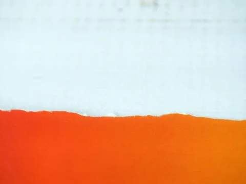 Red paper with torn edges placed on a white background. Stock Photos