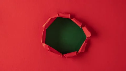 Red paper is torn over green background for message, stop motion, animation. 動画素材 145358857