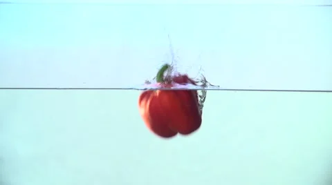 Red Paprika Falls in Water Slow Motion Stock Footage 59307262