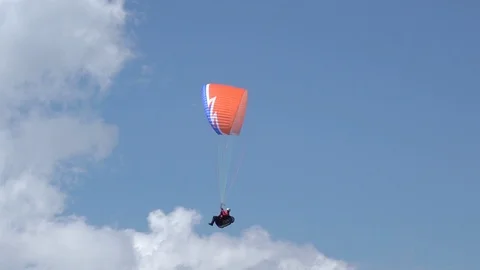 Red Paraglider and Clouds Close-up Stock Footage 125555901