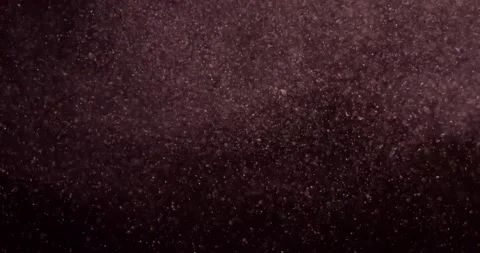 Red particles on black screen slow motion. Filmed with RED camera. Stock-Footage 219849472