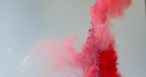 Red Particles blast up on light gray background Stock Footage 98212856