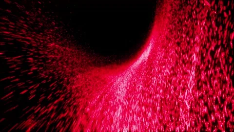 Red particles flying and spinning in black background. Glowing light in dark Stock Footage 262372653