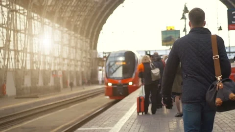 Red passenger train arriving to a station Stock Footage 95998140