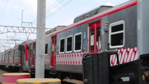A red passenger train passes at high speed. Stock Footage 287293498