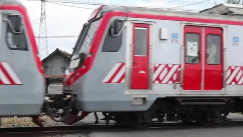 A red passenger train passes at high speed. Stock Footage 287293552