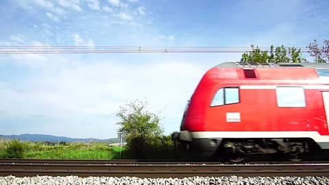Red passenger train side view with audio Stock Footage 111349721