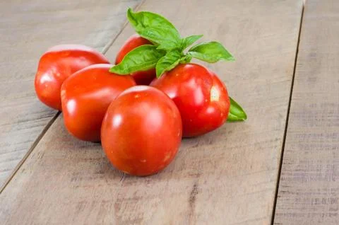 Red paste tomatoes on a wooden table 写真素材