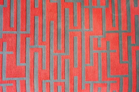 Red pattern with maze on retro fabric texture. Foto stock