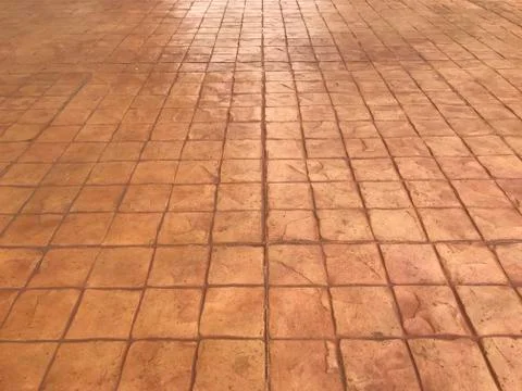 Red pattern stone pavement background in perspective. Square brick block grou Stock Photos