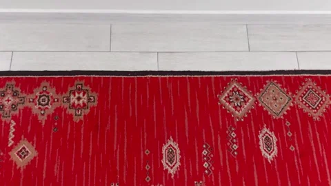 Red Patterned Rug on White Tile Floor Stock Footage 310165505