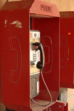 Red pay phone Stock Photos
