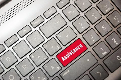 Red PC button with Assistance written Stock Photos