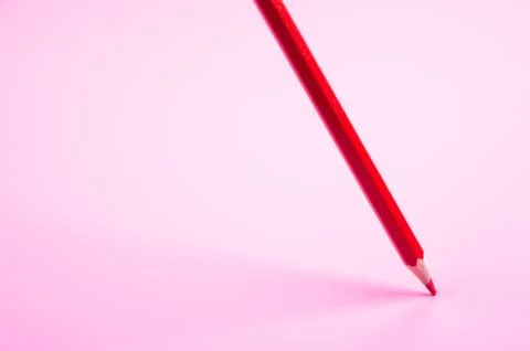 Red pencil Floating on red background Stock Photos