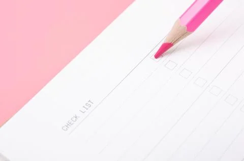 Red pencil floating on white note Stock Photos
