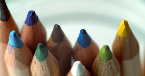 Red pencil put back into jar of colored pencils in slow motion Stock Footage 113142974
