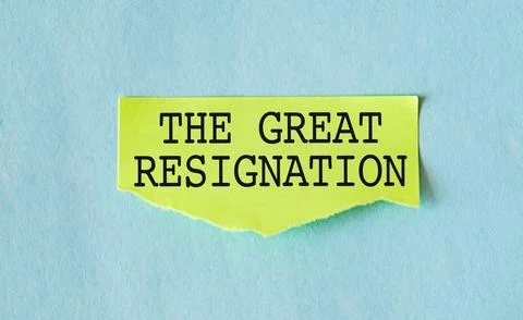 Red pencil on torn note with text written THE GREAT RESIGNATION, means the .. Stock Photos