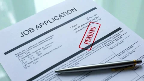 Red pending stamp on job application document Stock Footage 332725080