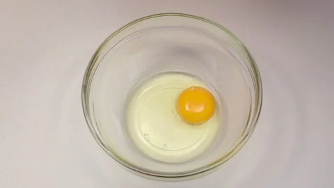 Red pepper is added to bowl with egg, slow motion Stock Footage 76148099