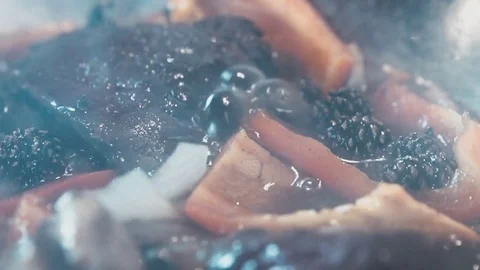 Red pepper and stewed berries in a skillet Stock Footage 73214577