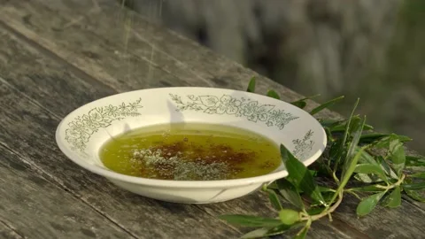 Red pepper and thyme on olive oil in a nice plate. Stock Footage 144303805
