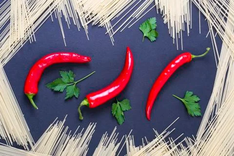 Red pepper on a black background. Pasta with vegetables on a black background Foto stock