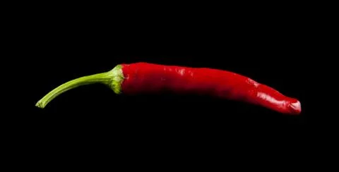 Red pepper on a black background Stock Photos