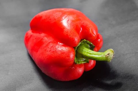 Red pepper on black background Stock Photos