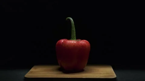 Red pepper on a black background. Still frame, 4k. Stock Footage 300678188