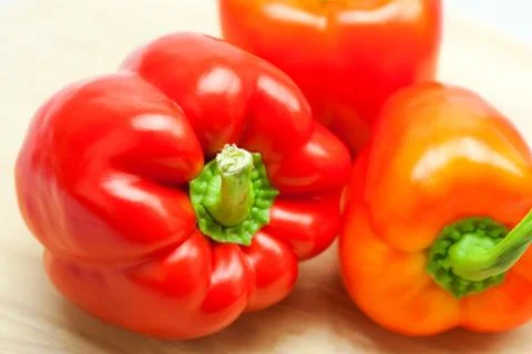 Red pepper on a cutting board isolated on white Foto stock