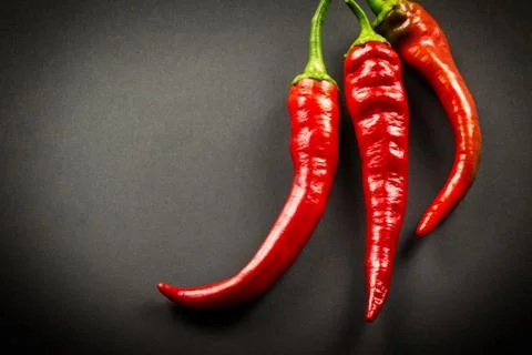 Red pepper on a dark background, close-up Stock Photos