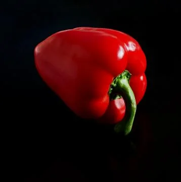 Red pepper on a dark table Stock Photos