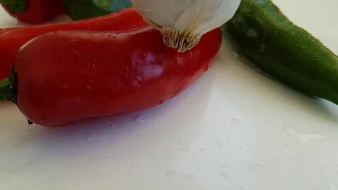 Red pepper drops garlic Stock Footage 88292891