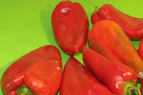 Red pepper on a green background Stock Photos