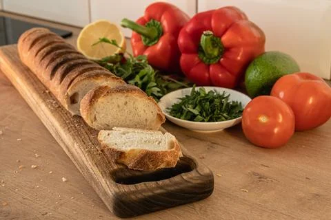 Red pepper, lemon, avocado, bread and other vegetables. Healthy eating at home Stock Photos