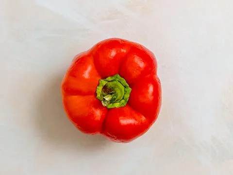 Red pepper, one light background, photo from above, vegetarian food Stock-Fotos