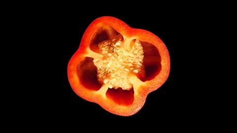 Red Pepper Slice Rotating on Black Background in 60p Stock Footage 337682078