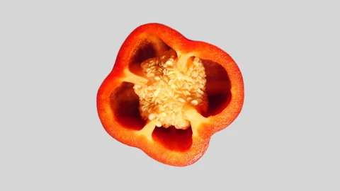 Red Pepper Slice Rotating on White Background in 60p Stock Footage 337682622