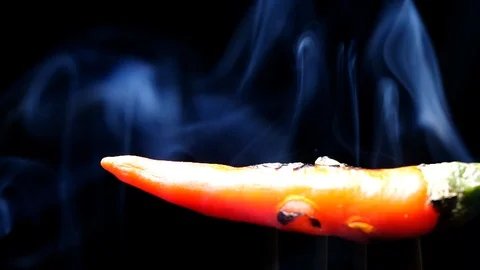 Red pepper with smoke in slow motion on black background Stock Footage 114689867