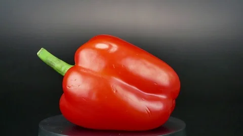 Red pepper spins on a black background. Stock Footage 122944840