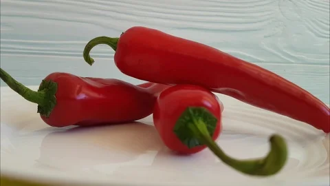 Red pepper turns on a plate Stock Footage 87031581