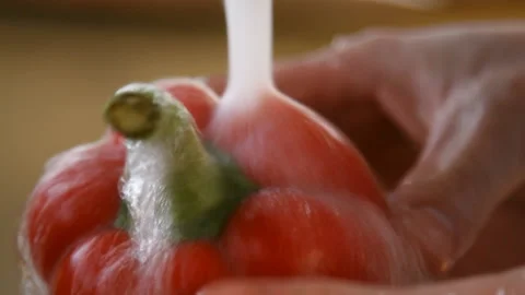 Red pepper under running water. close-up Stock Footage 87037268