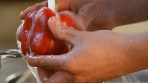 Red pepper under running water Stock Footage 87037341